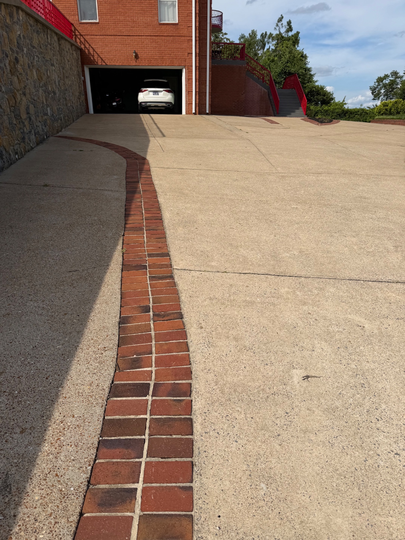Before and after of the garage approach cleaning project